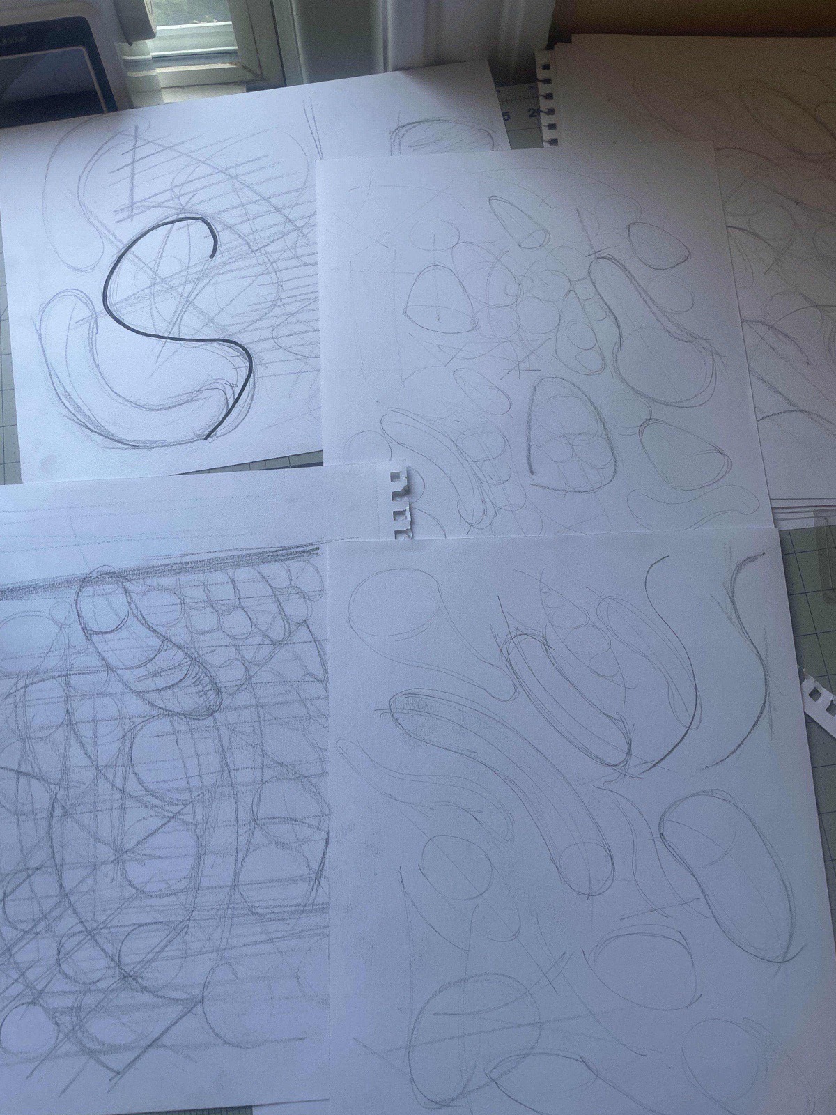 several pages of pencil curve and oval practice